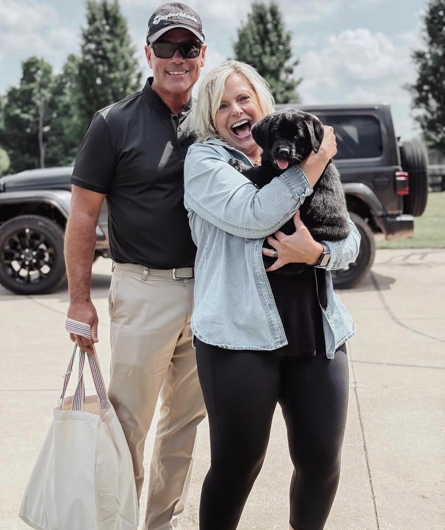 Family with Lab puppy