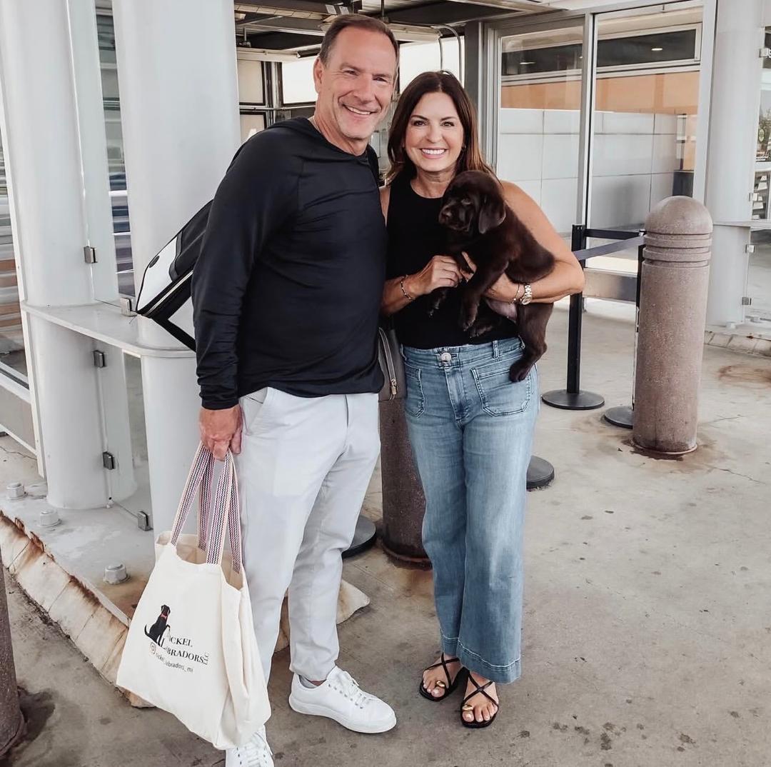Family with Labrador puppy